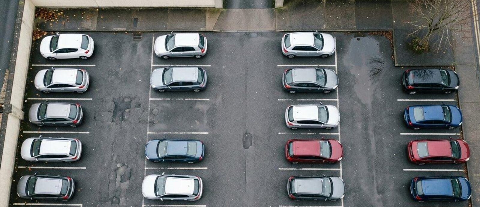 A car park photographed from above, with no markings.